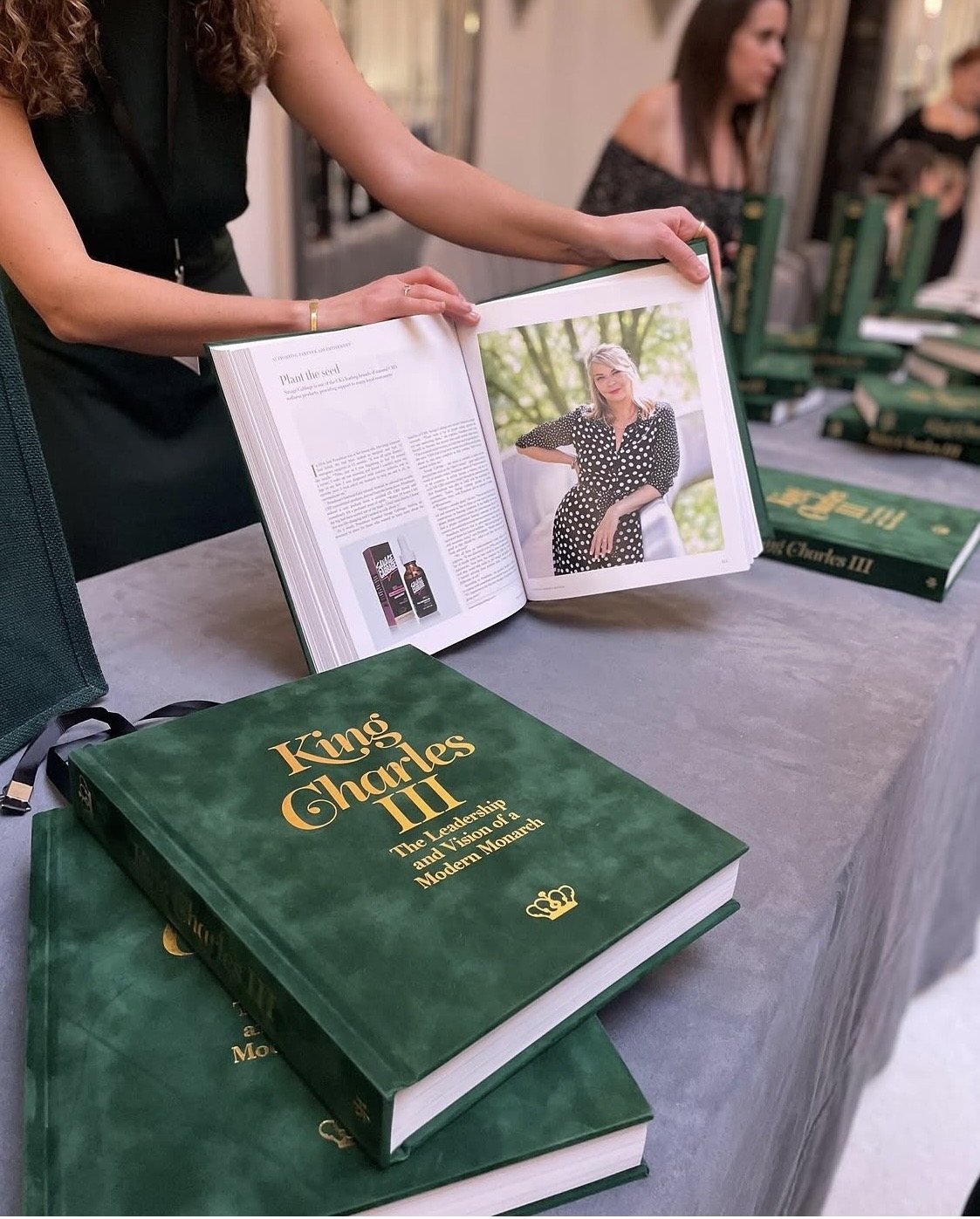 An open copy of King Charles III: The Leadership and Vision of a Modern Monarch, showing a feature on Jade